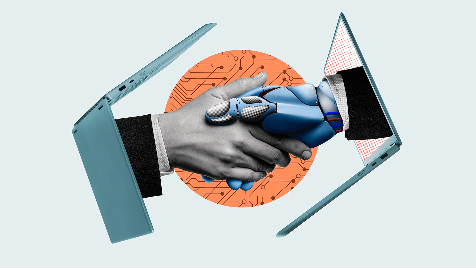 two hands—one human, one robotic—emerge from laptops for handshake
