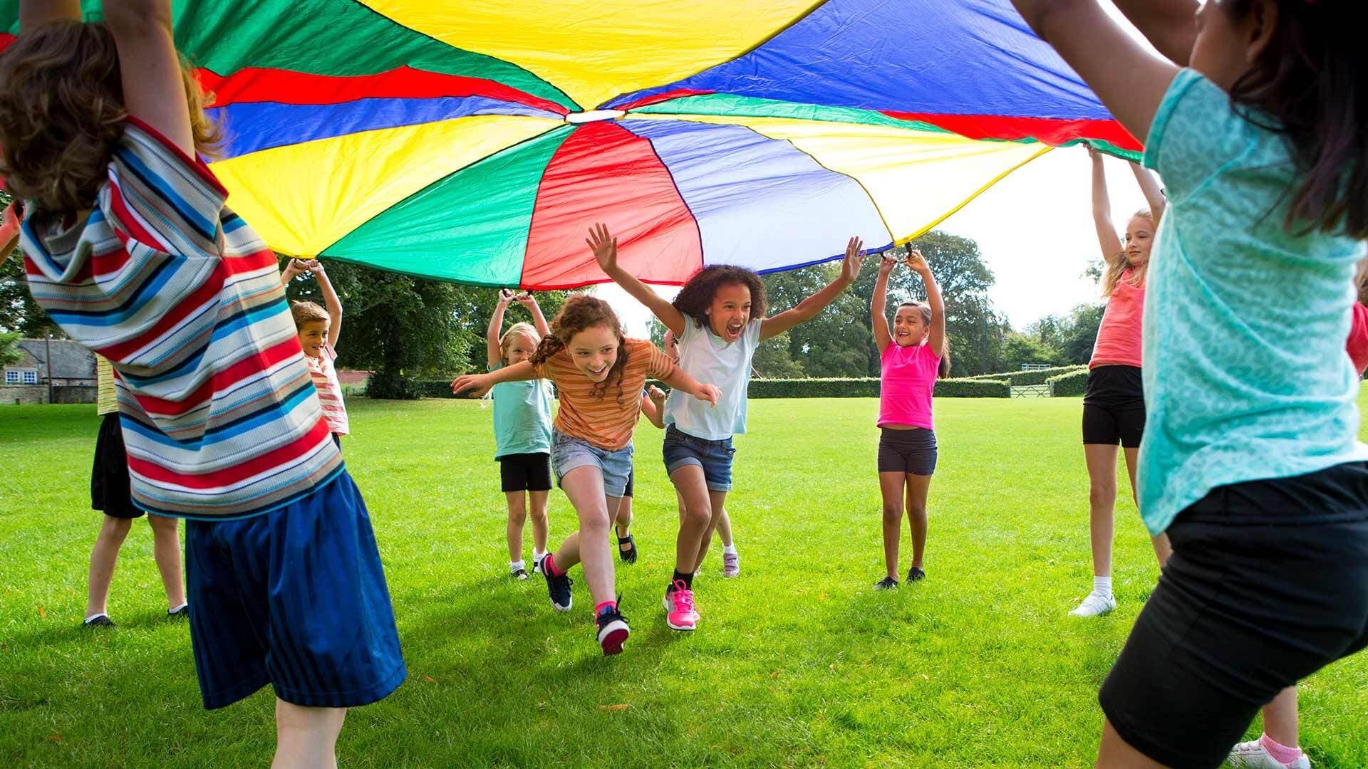 Children play with parachute