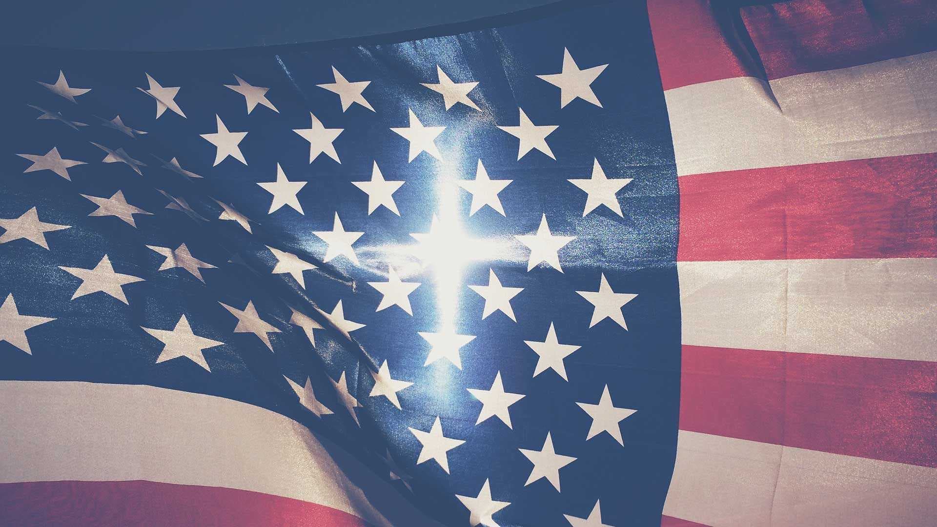 American flag with cross-shaped ray of light