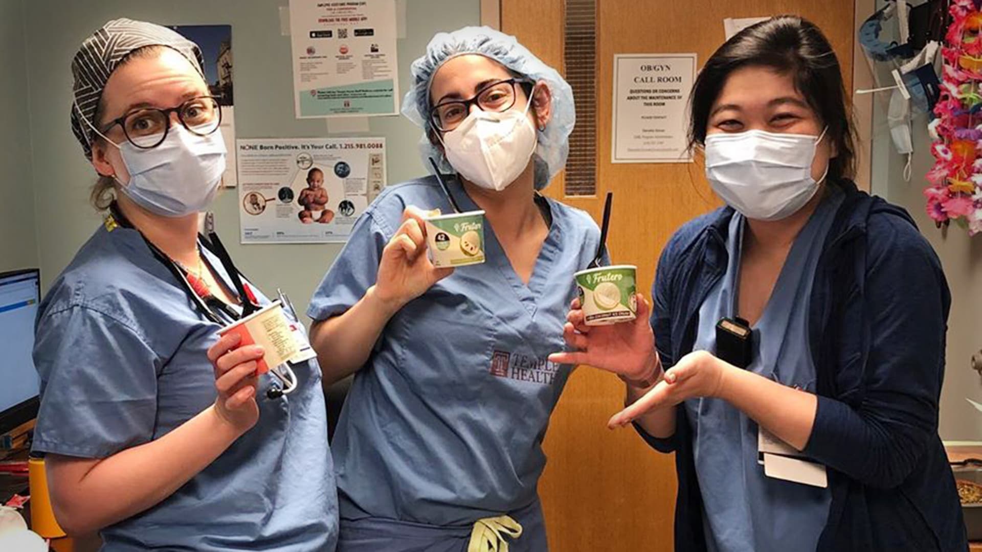 Hospital workers pose with ice cream