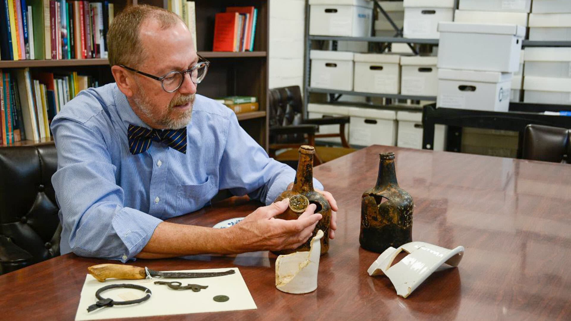 Interim Dean Donald Linebaugh working with artifacts from the Kippax Plantation Archaeological Site.