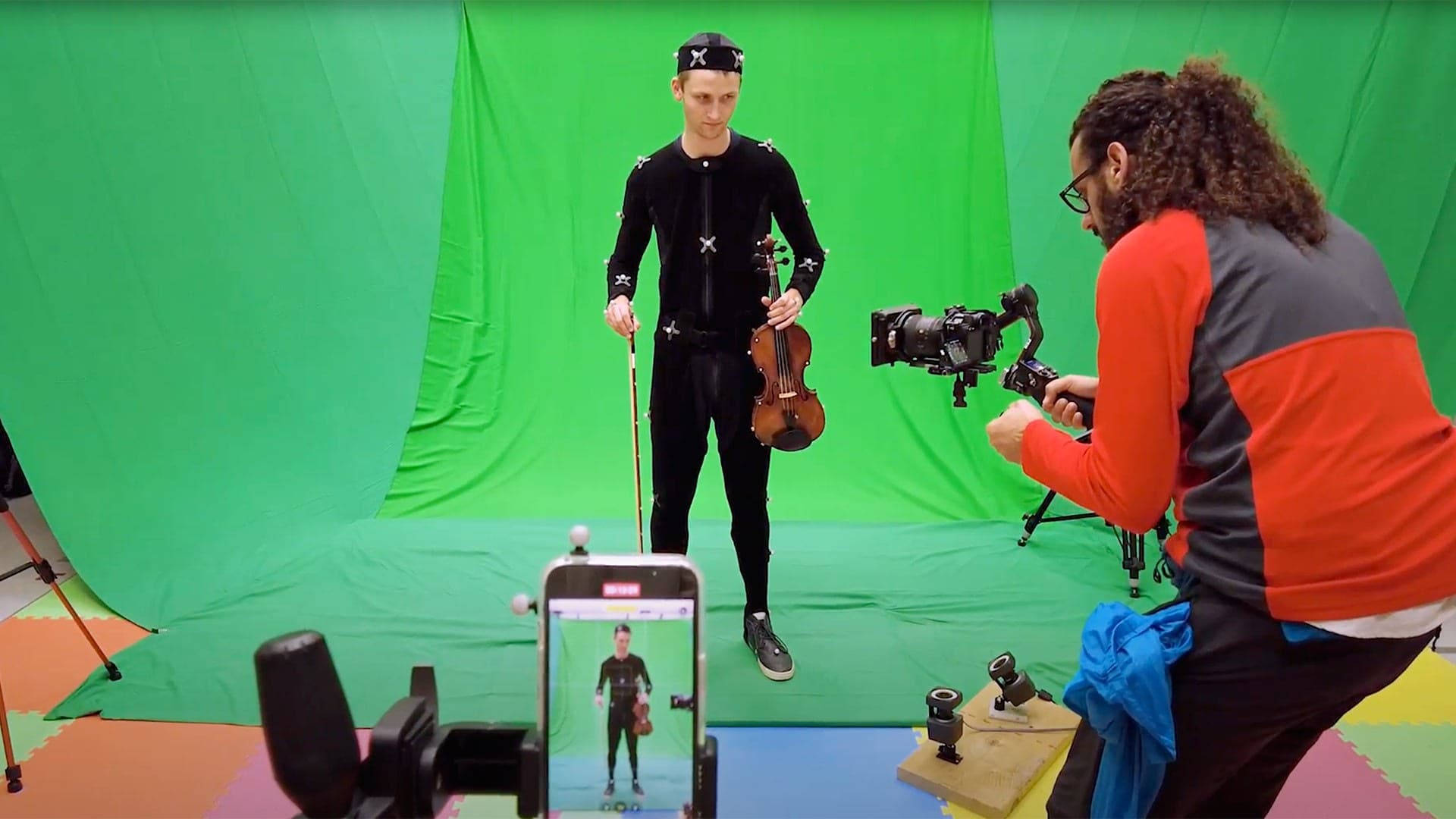 two people record violin AI video in front of green screen