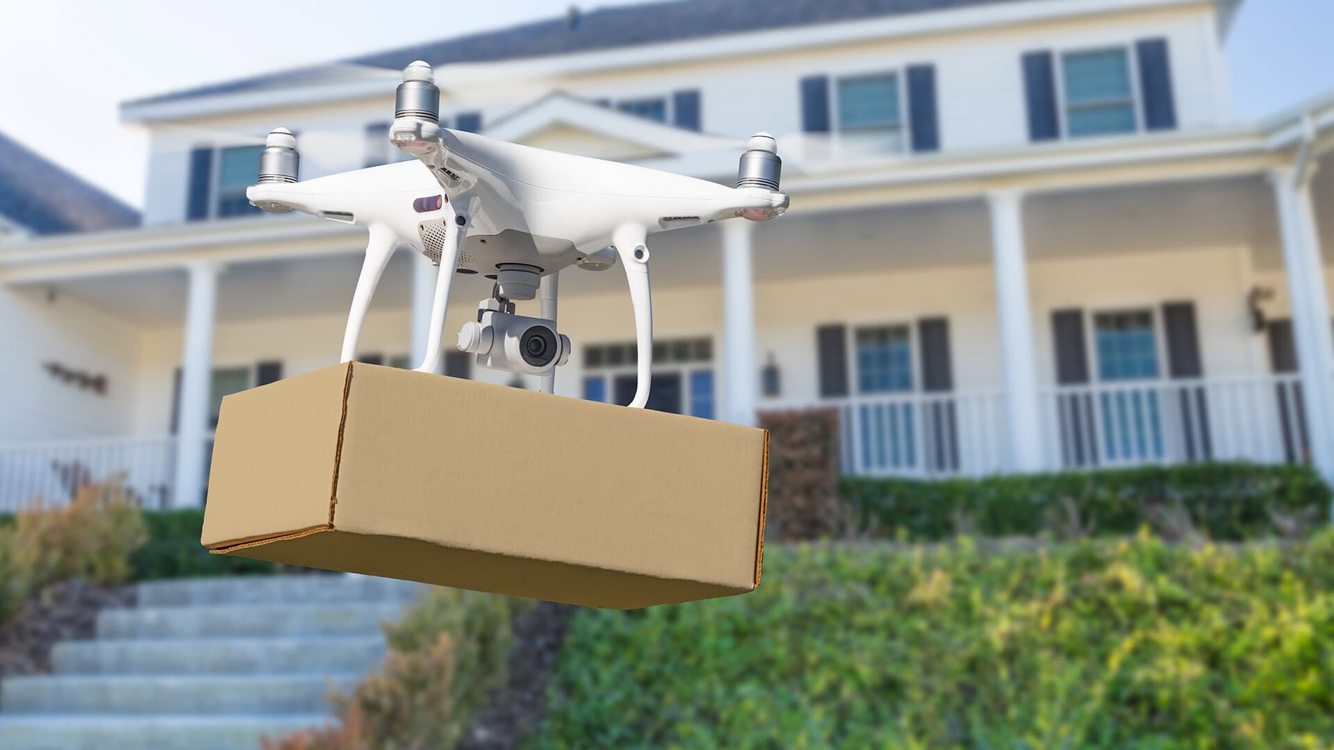 Drone flies package to suburban house