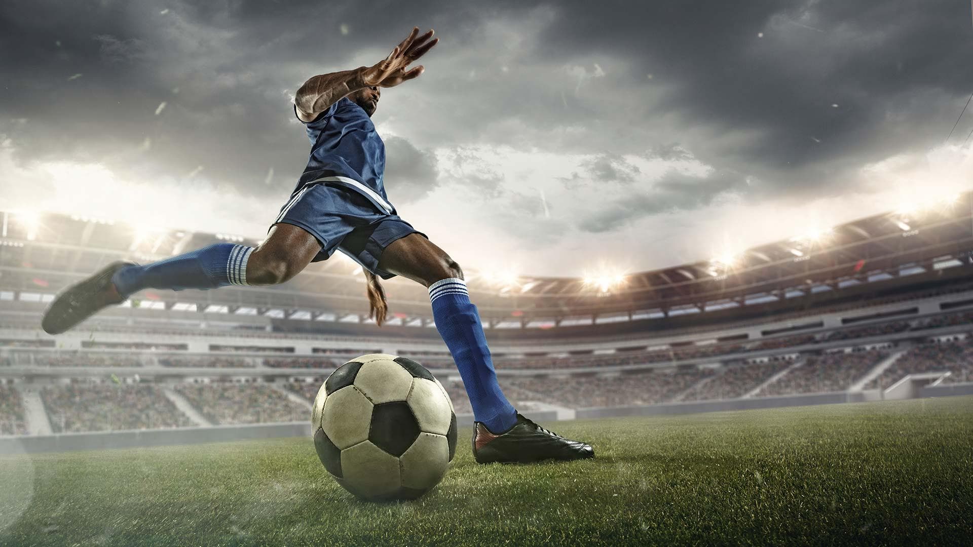 Soccer player kicks ball