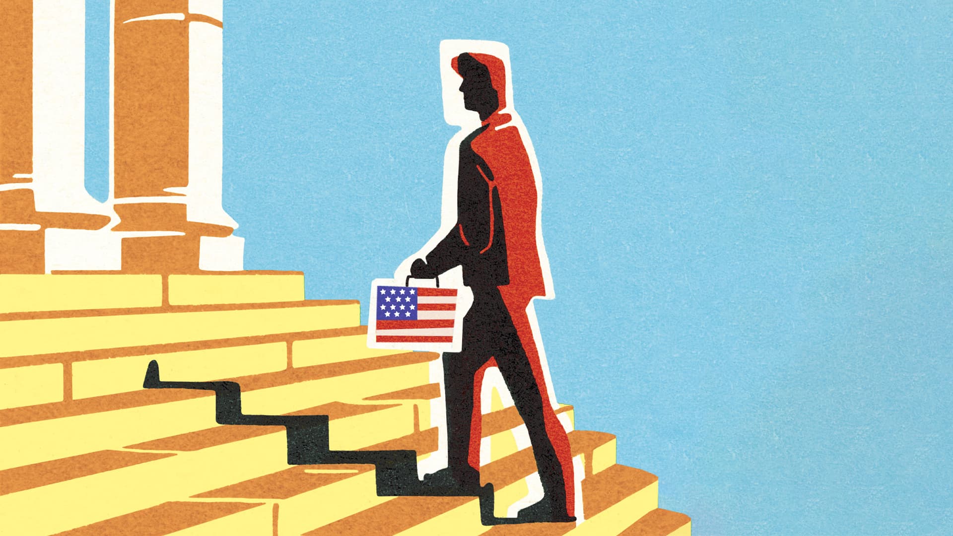 A man walks up steps carrying a box with the American flag on it