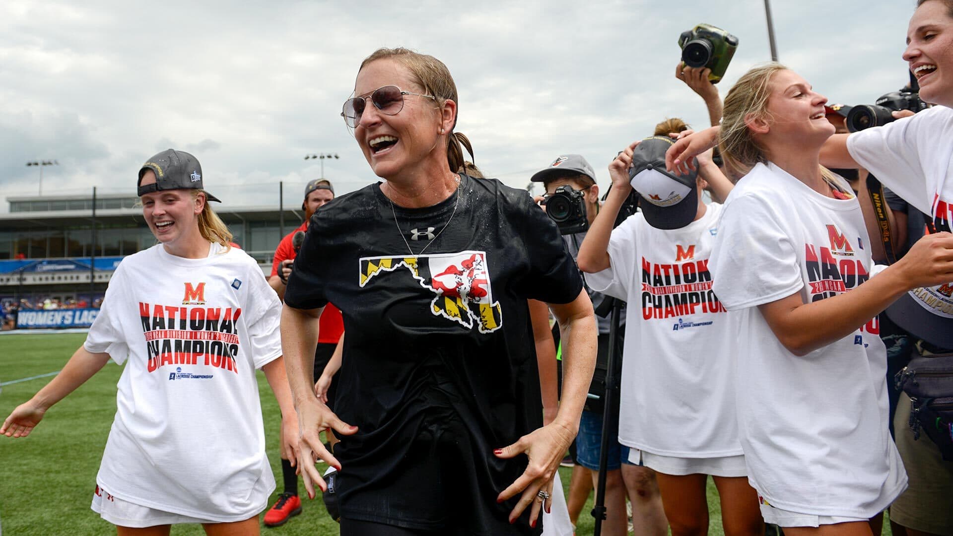 Head Coach Cathy Reese celebrates women's lacrosse title