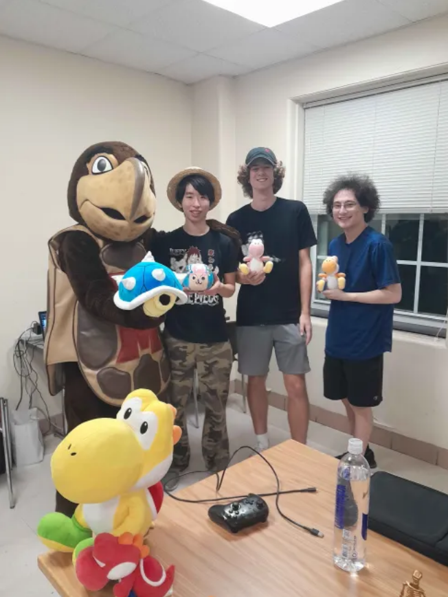 Three students with Testudo mascot