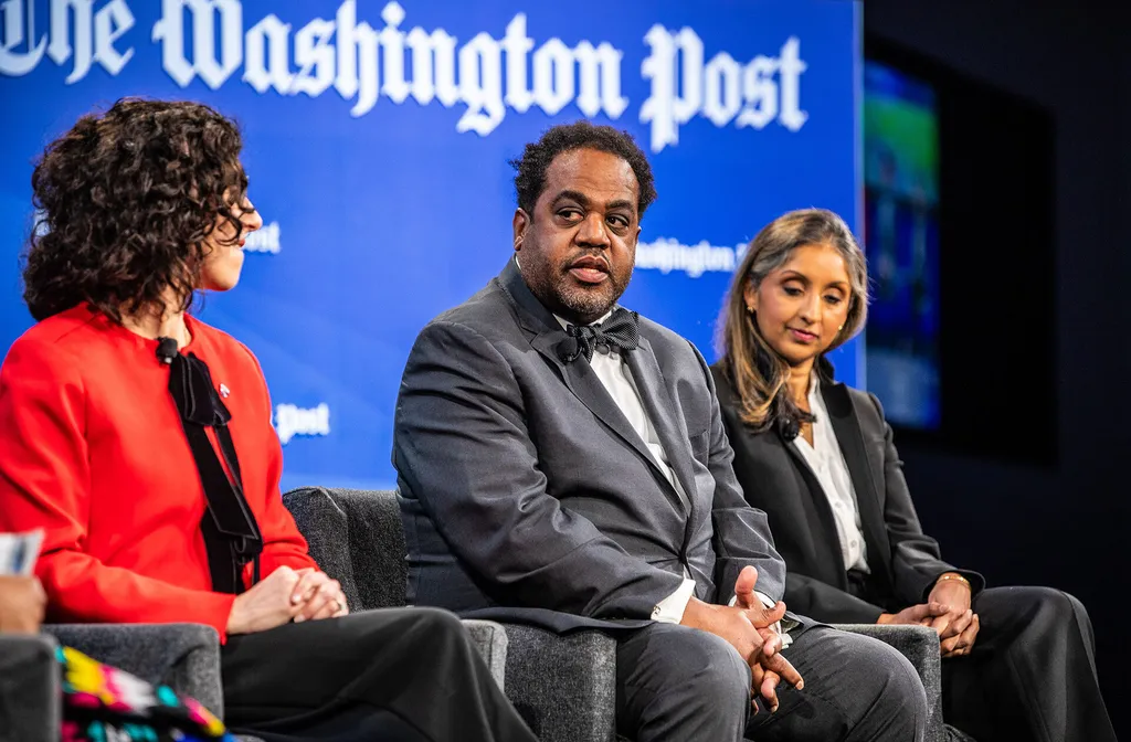 Joseph Richardson Jr. speaks with two others during Washington Post panel