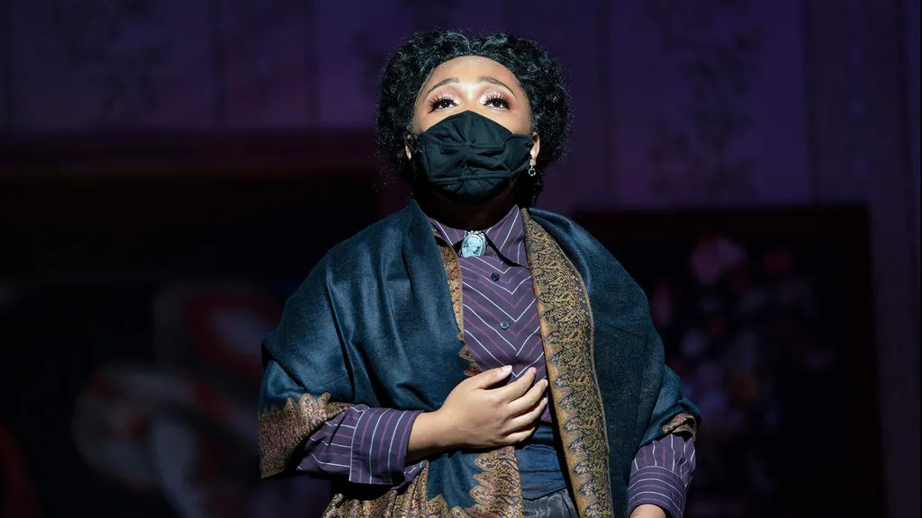 Marmee (Jordan Embrack ’25) sings about grief and hope in her solo “Days of Plenty” in "Little Women"