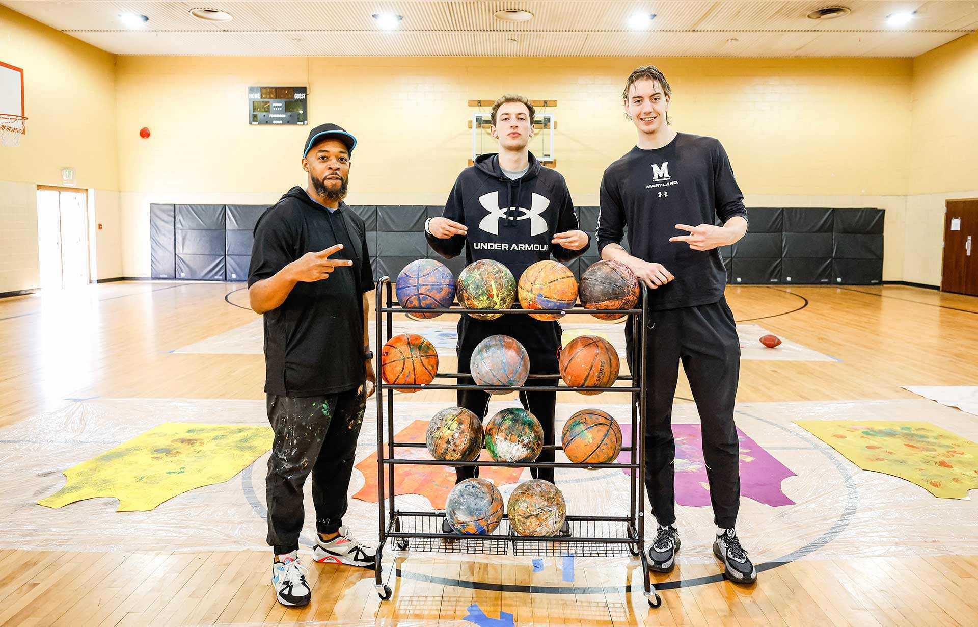 Brandon Donahue-Shipp, assistant professor of art, two two UMD basketball players