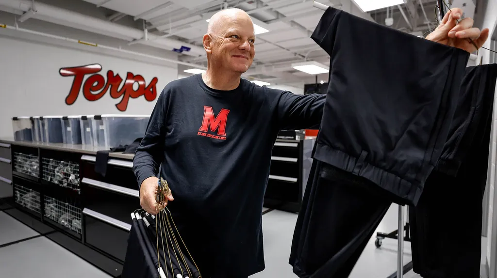 Drew Hampton hangs football pants