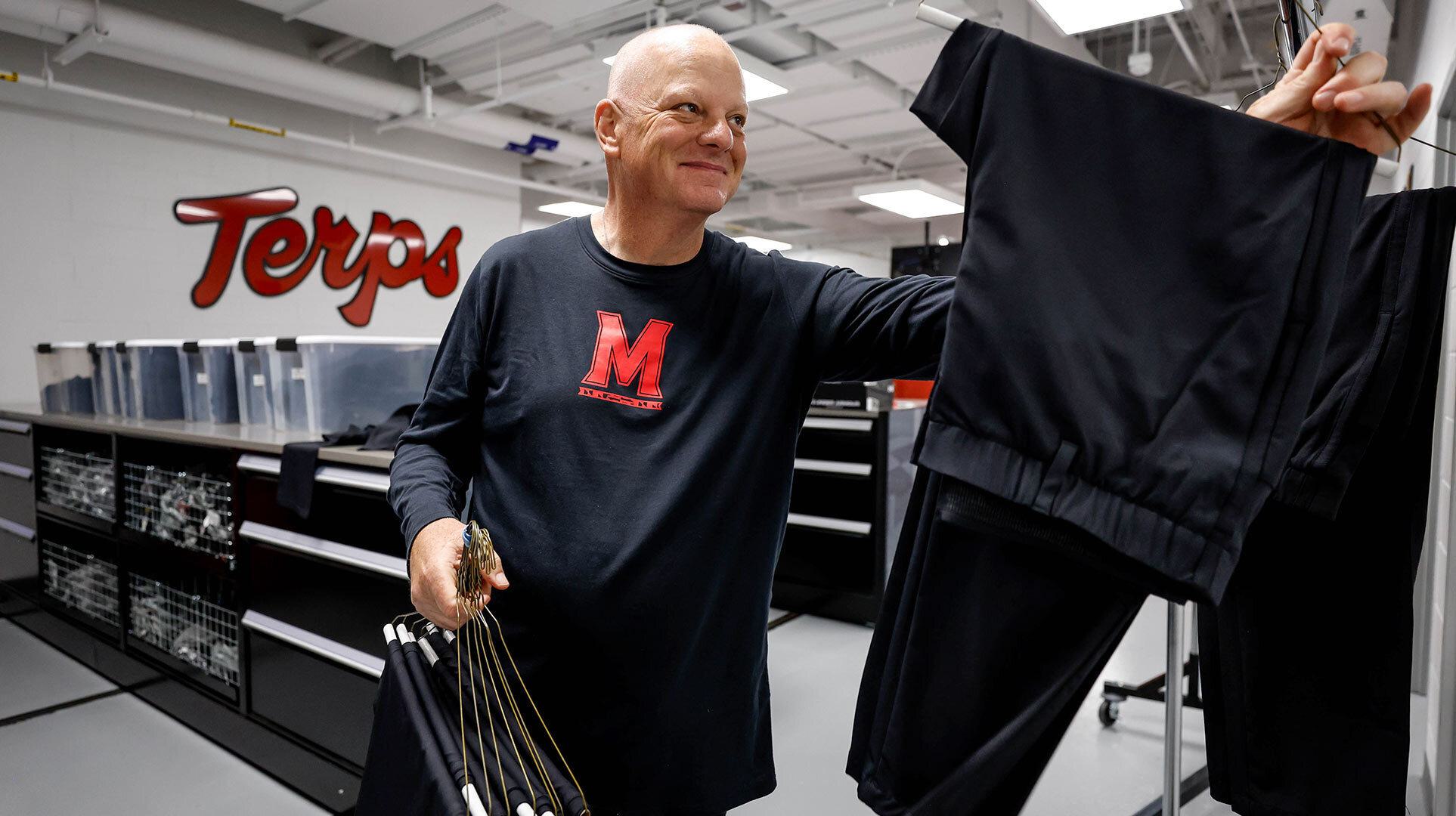 Drew Hampton hangs football pants
