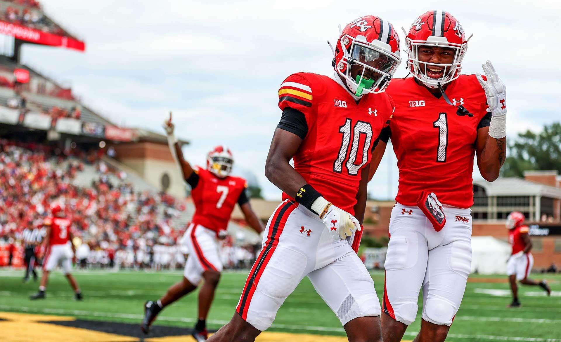 two Maryland players celebrate a score