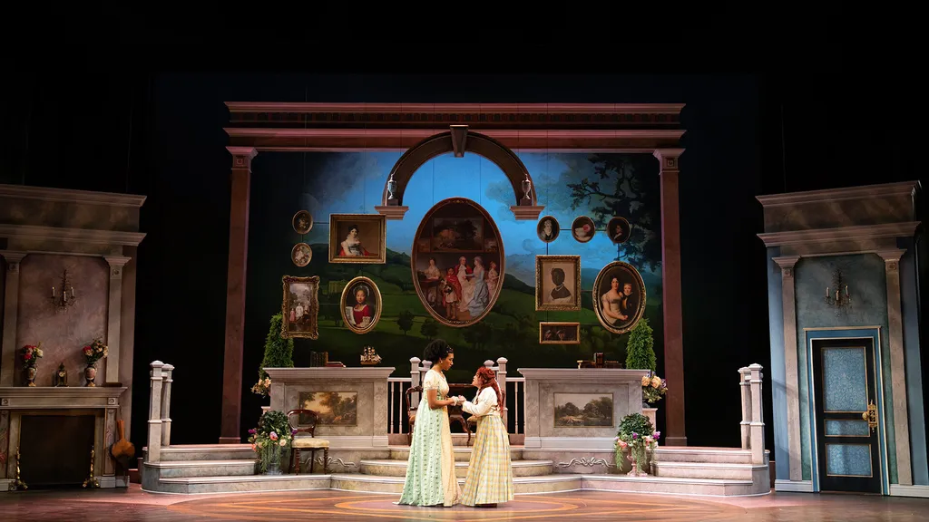 two actors hold hands on stage in "Emma"