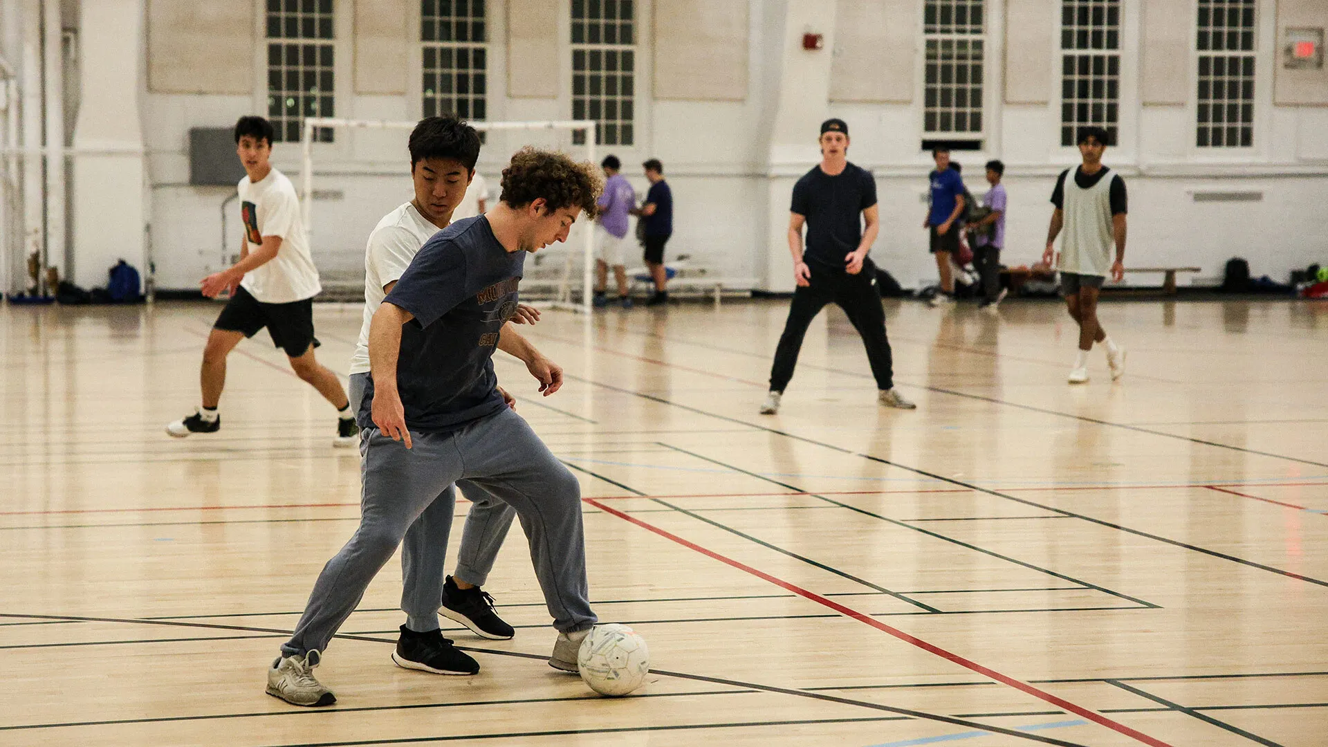 students play futsal