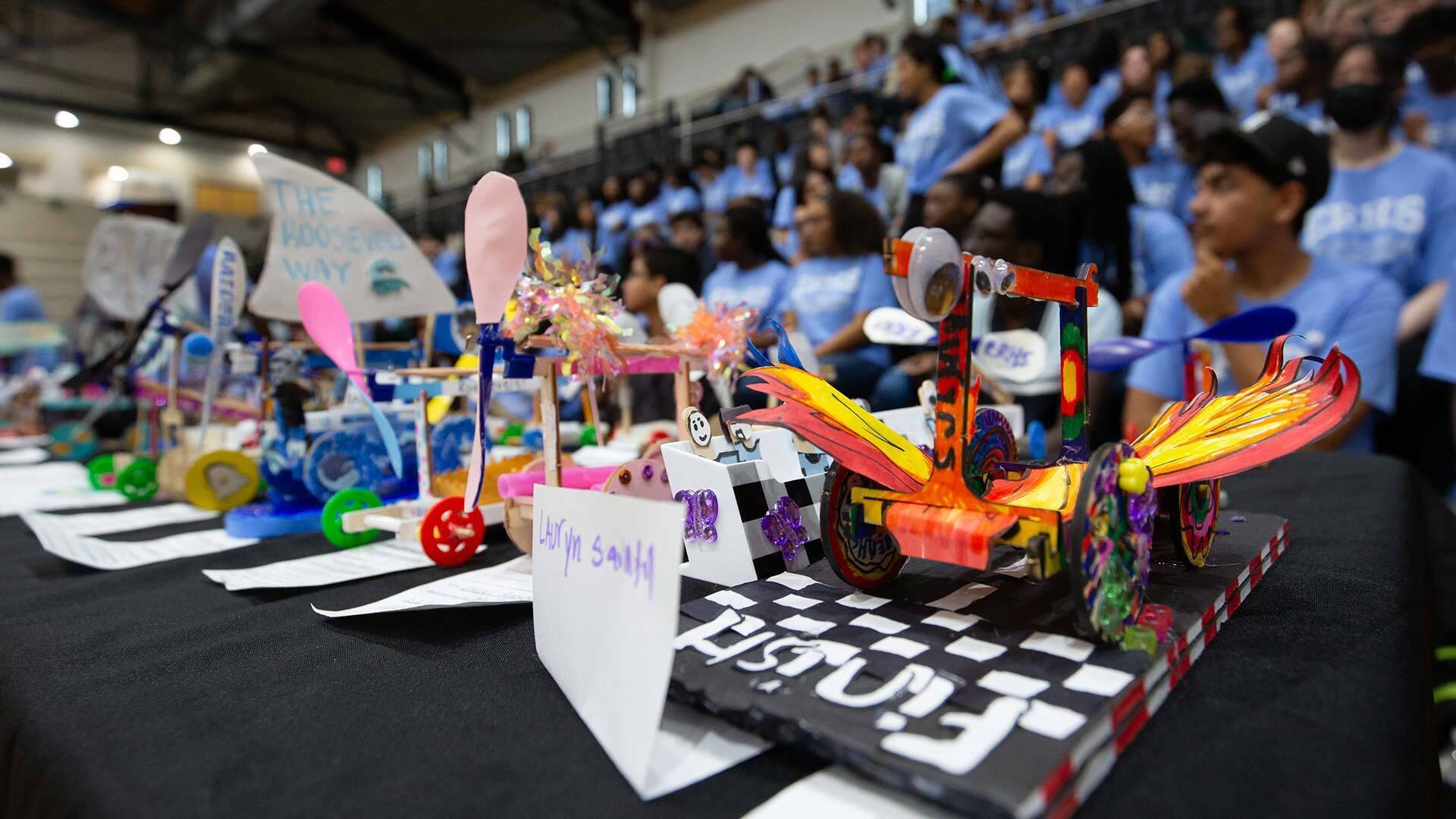 prop carts with students in background