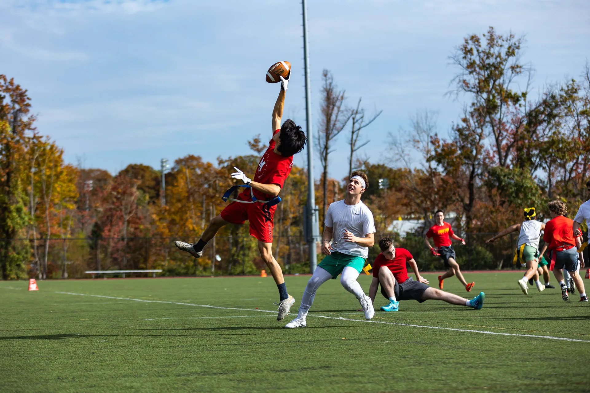 students play football on a field