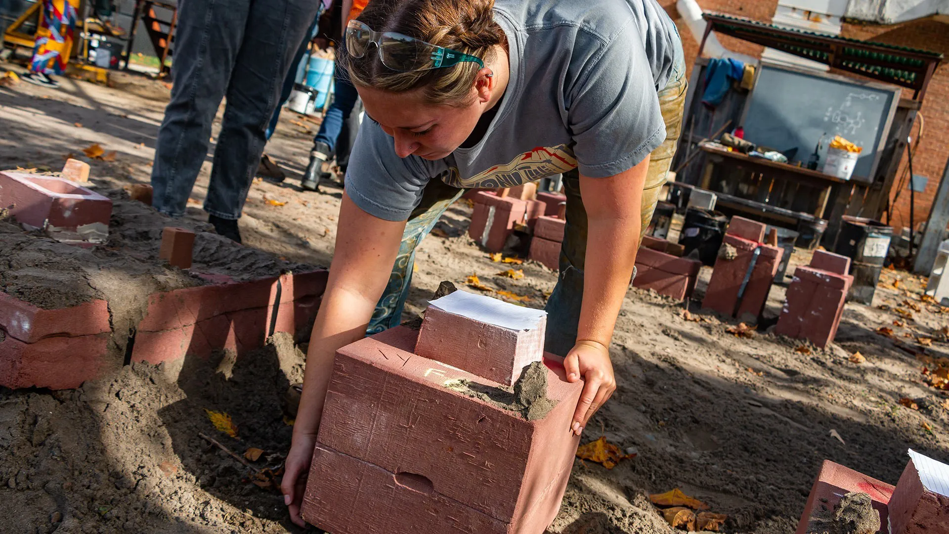 student picks up mold