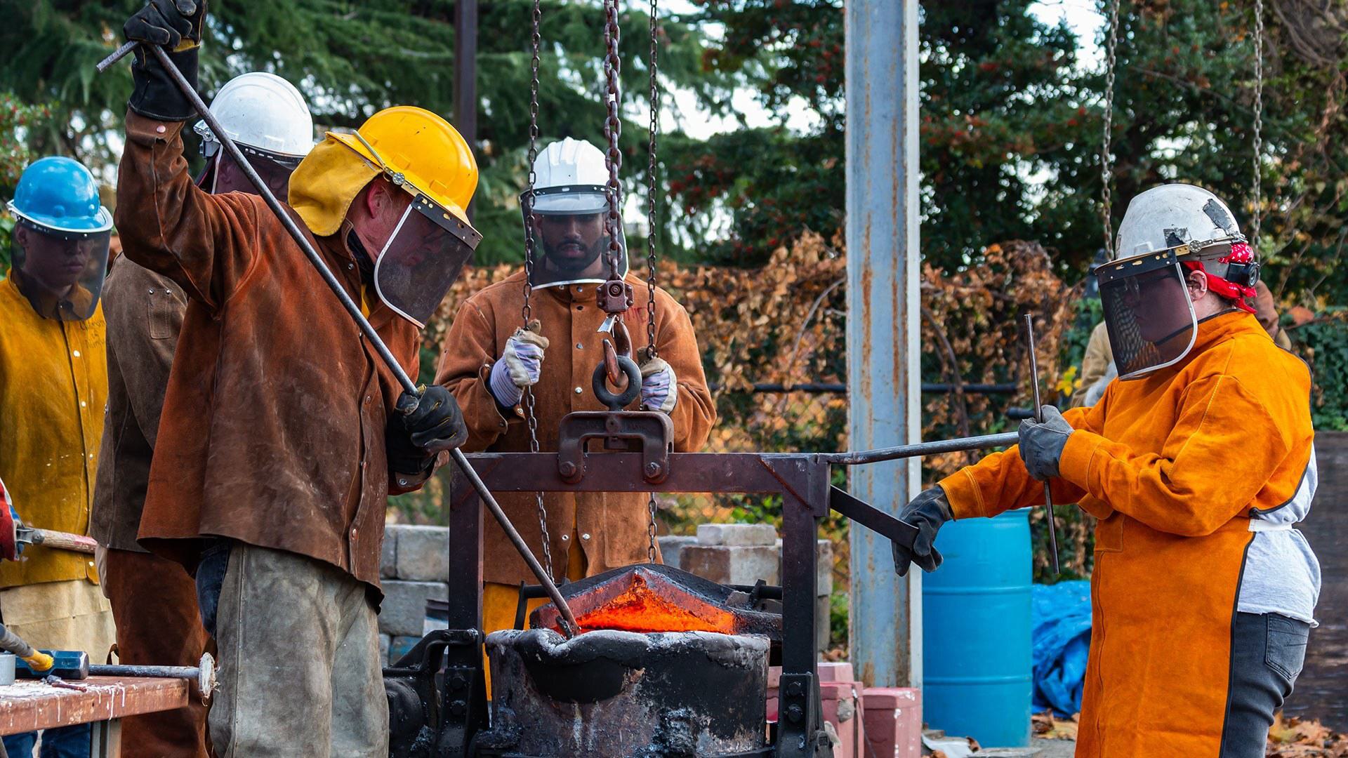 students work with iron