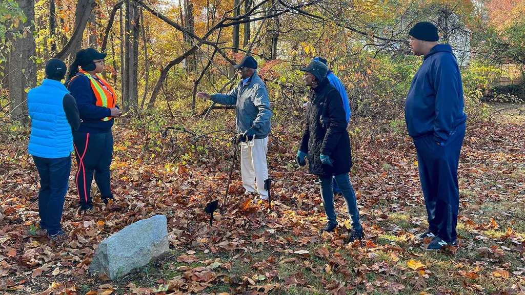 People stand in the woods