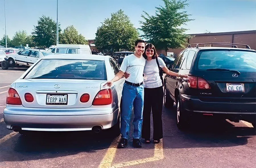man points to TERP MAN license plate, woman points to CAL GAL license plate