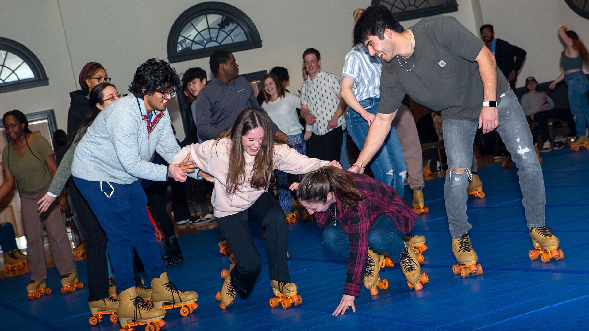students try skating, with two of four falling