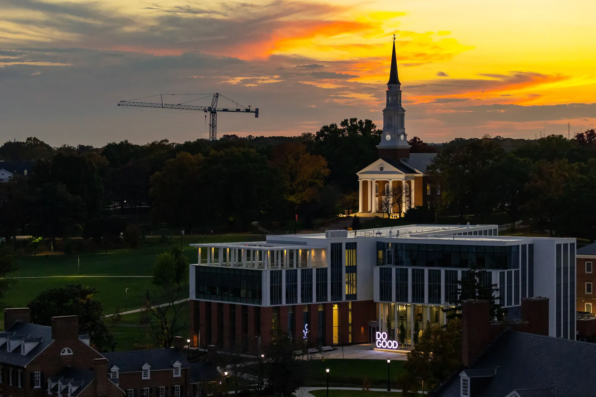 sunset view of Thurgood Marshall Hall, Memorial Chapel with a crane in the background