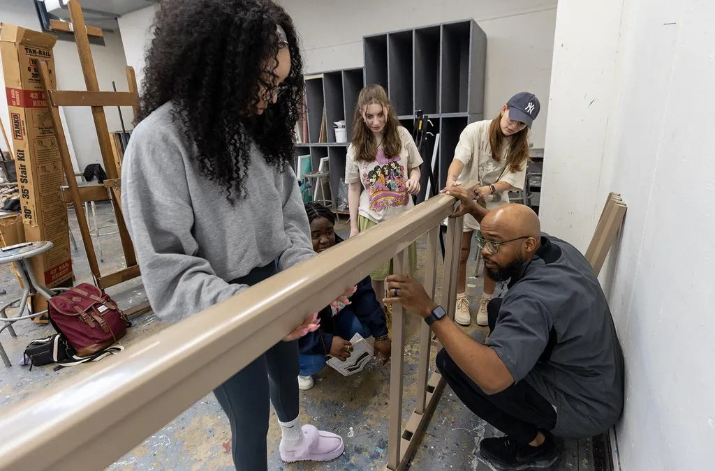 students and professor make canopy structure