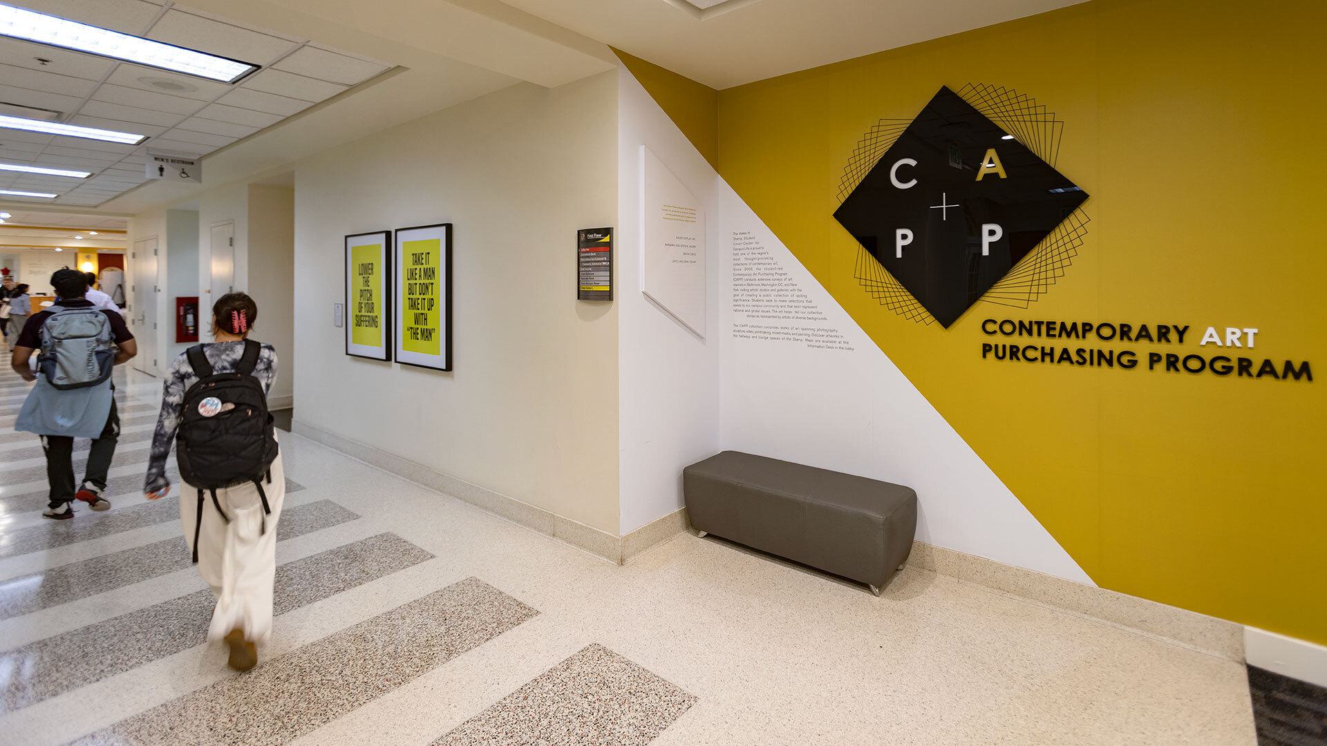 Contemporary Art Purchasing Program logo on wall in hallway