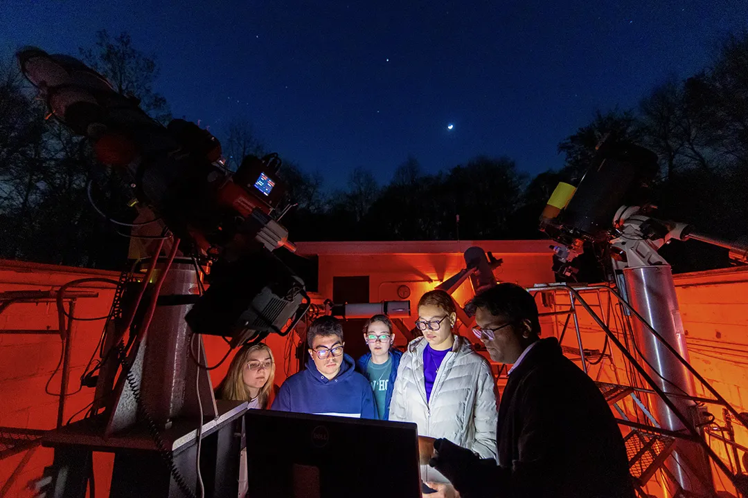students look at screen at observatory