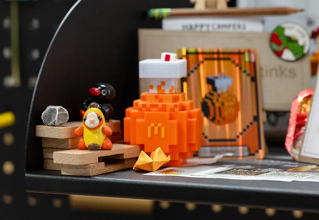 Cute objects including a McDonalds orange Lego creation, a penguin and banana cat made out of polymer clay
