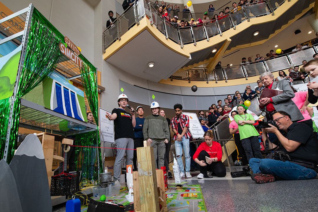 team shows off their rube goldberg machine