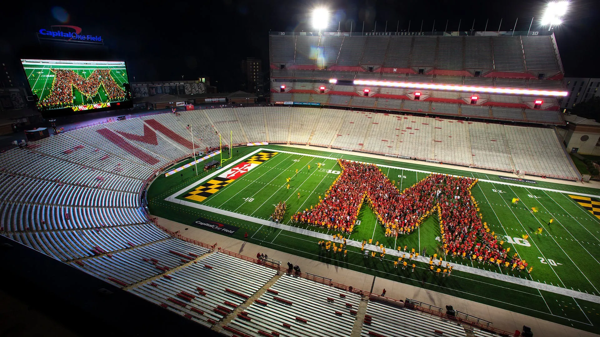 students form M on football field