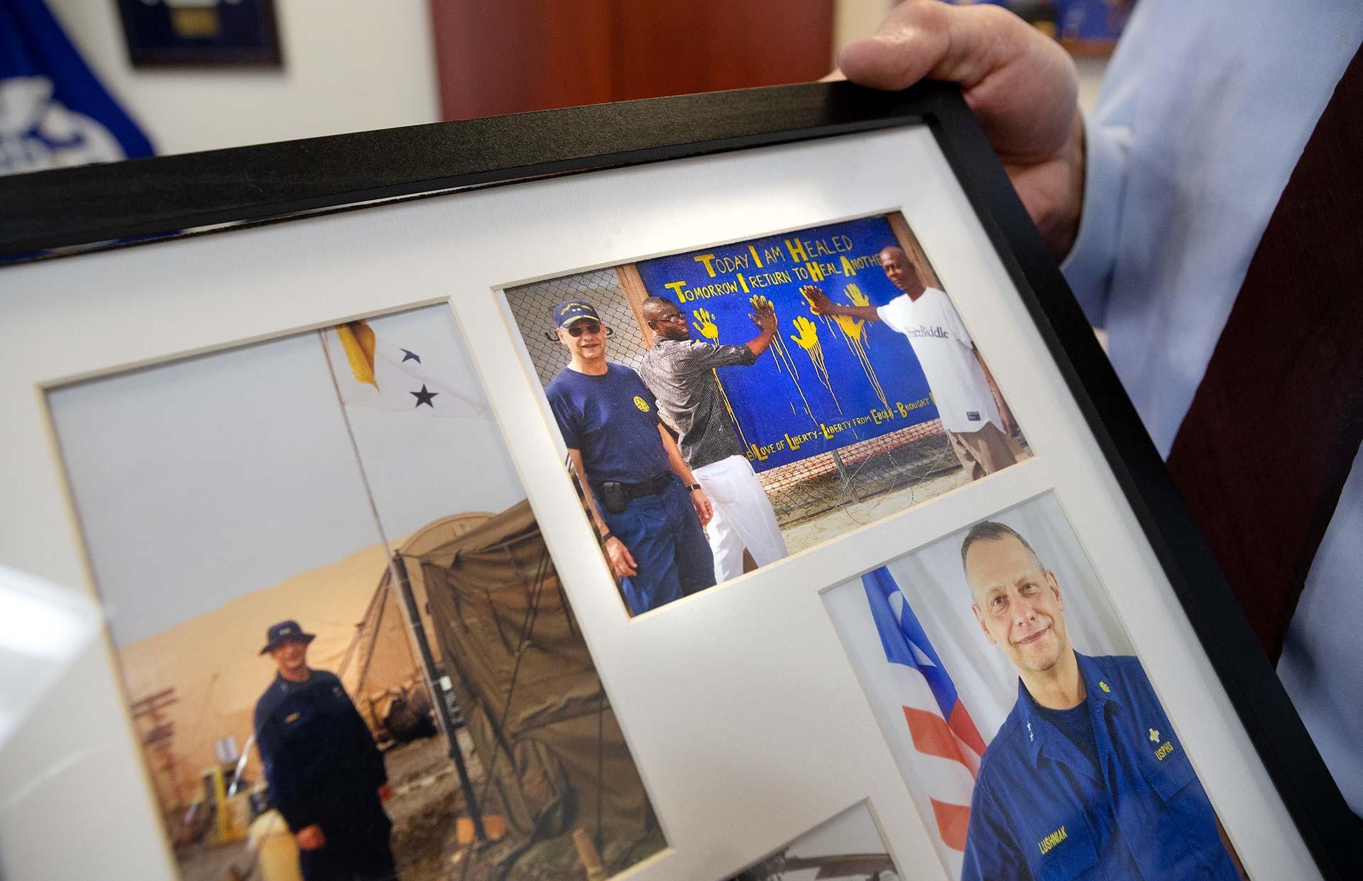 framed photos of Boris Lushniak on assignment