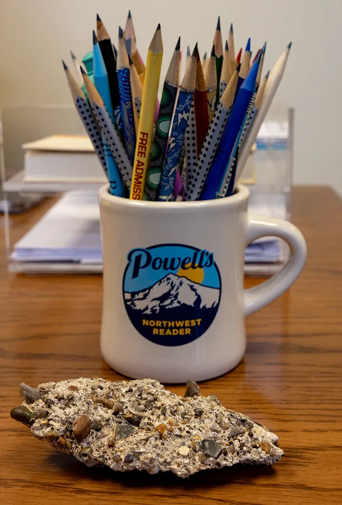 piece of wall next to mug of pencils