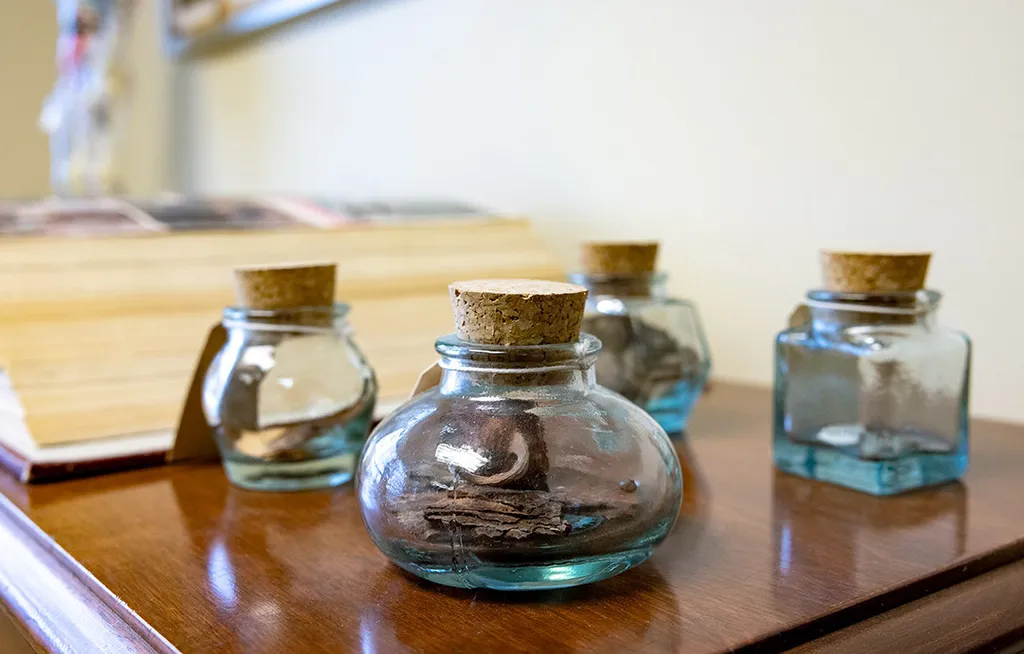 four jars with corks