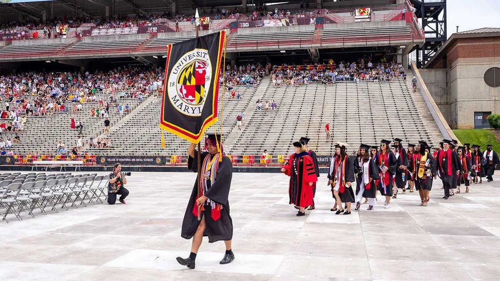 Student speaker M Pease leads graduates into commencement ceremony