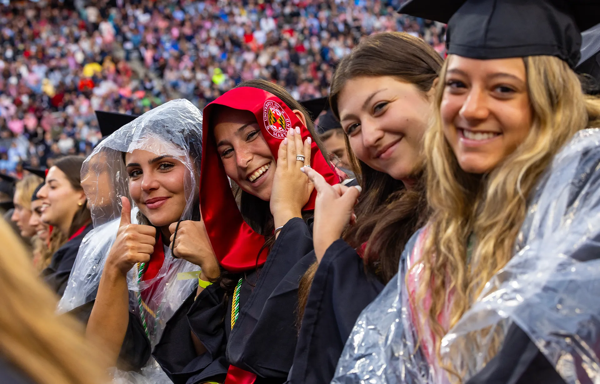 grads wear ponchos and regalia