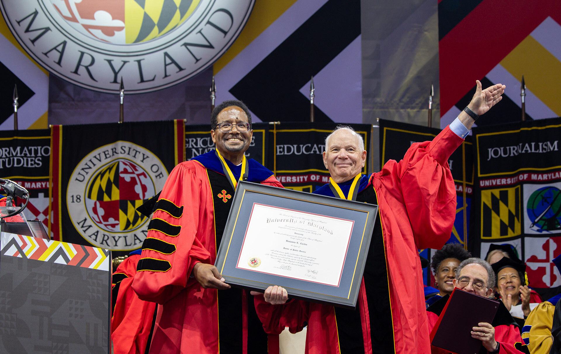UMD President Darryll J. Pines presents an honorary doctoral degree to former U.S. Sen. Ben Cardin
