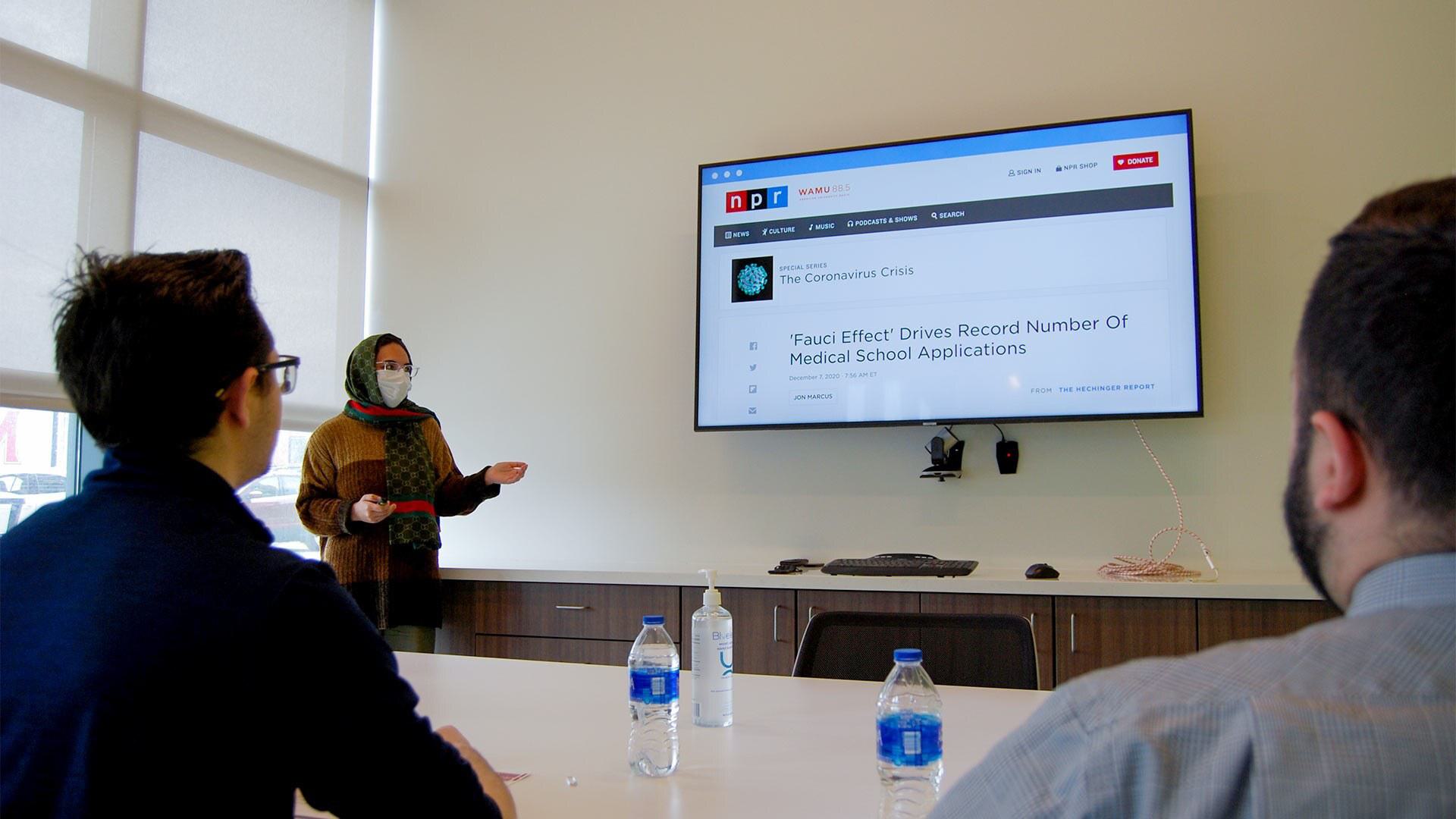 Minahil Cheema presents in a classroom