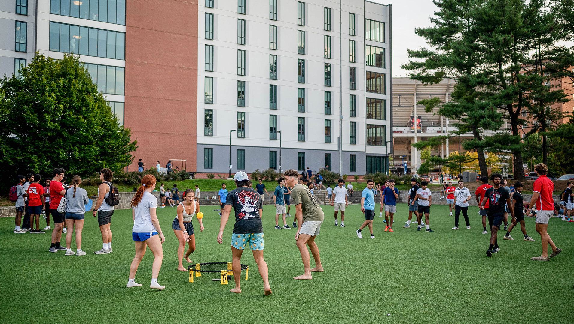 students play spikeball on LaPlata Beach