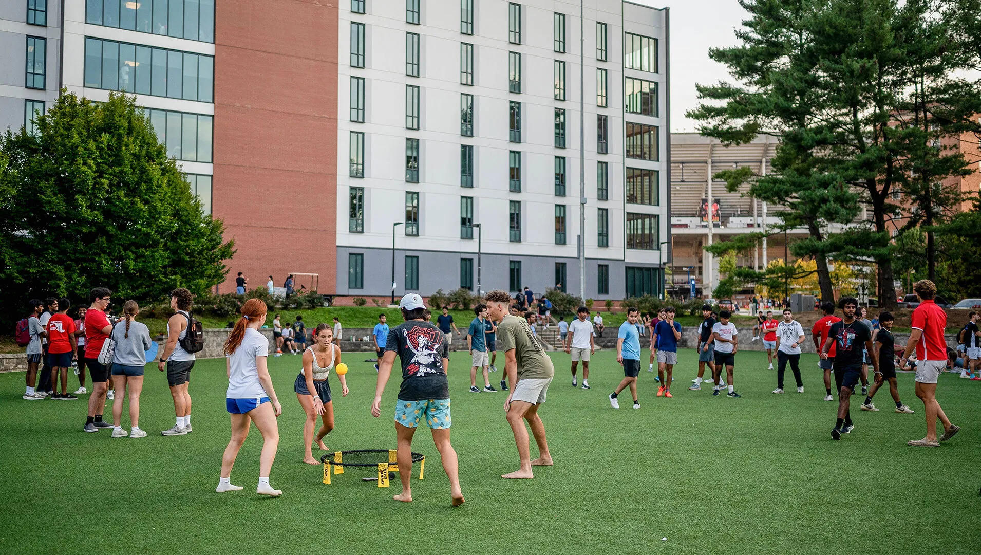 students play spikeball on LaPlata Beach