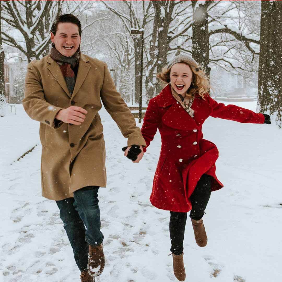 Dan Zawacki ’13 and Brooke Parker ’14 skip in the snow