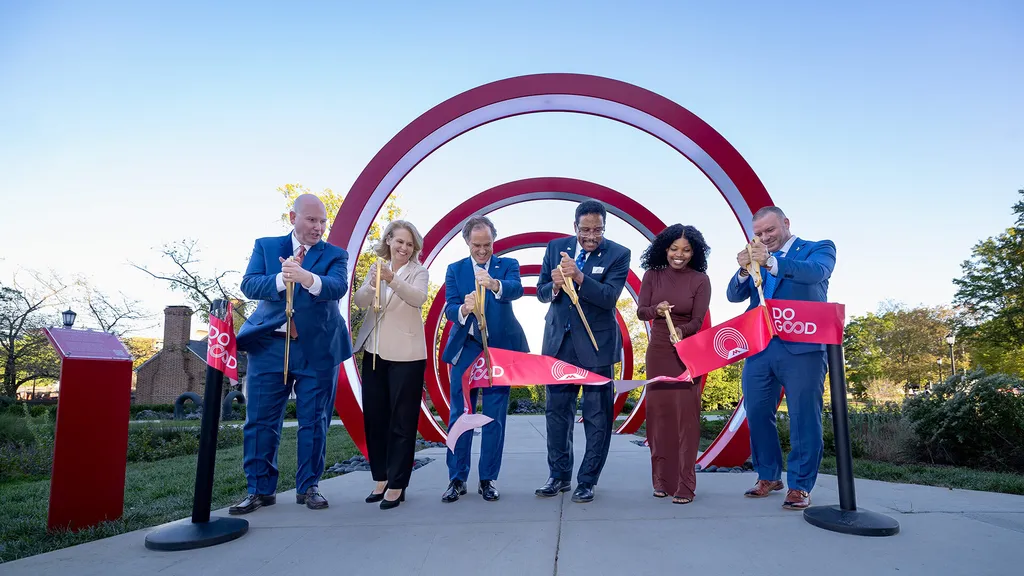 Line of people stand near the rings