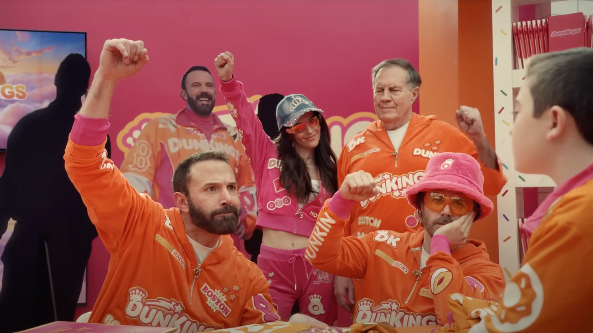 Ben and Casey Affleck, Bill Belichick and others pump fists in pink and orange Dunkin gear