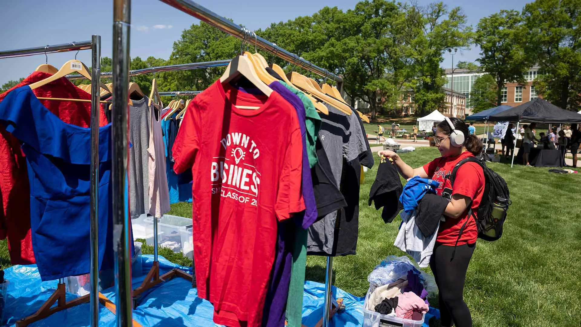 student browses clothing racks on McKeldin Mall