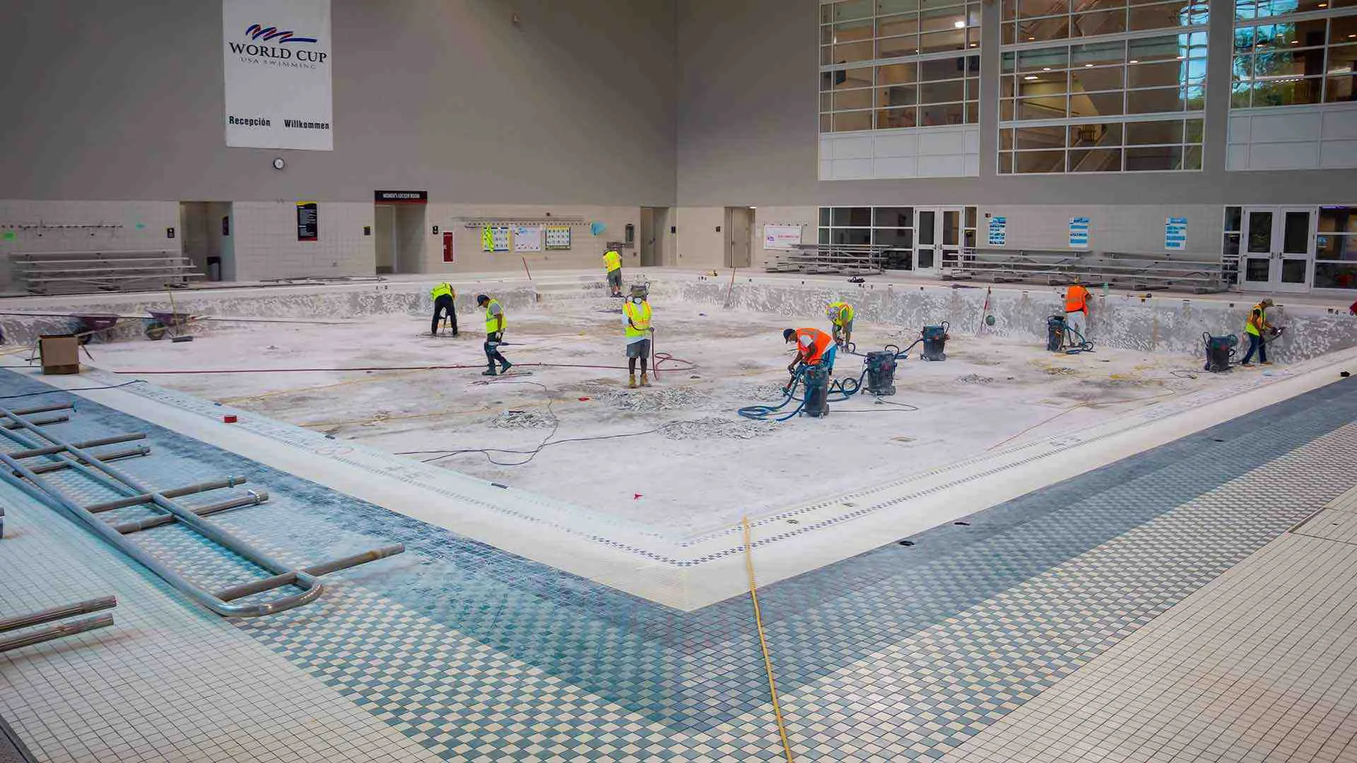 Staffers work in empty pool