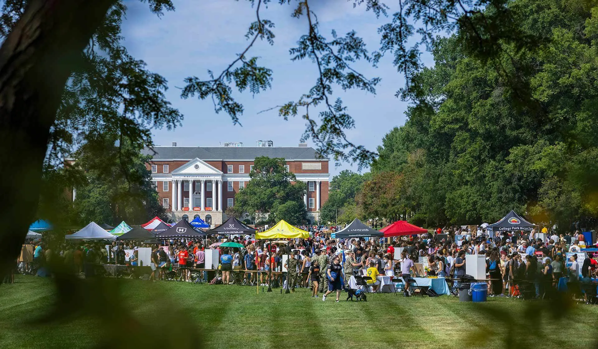 A crowd of tents and students on McKeldin Mall