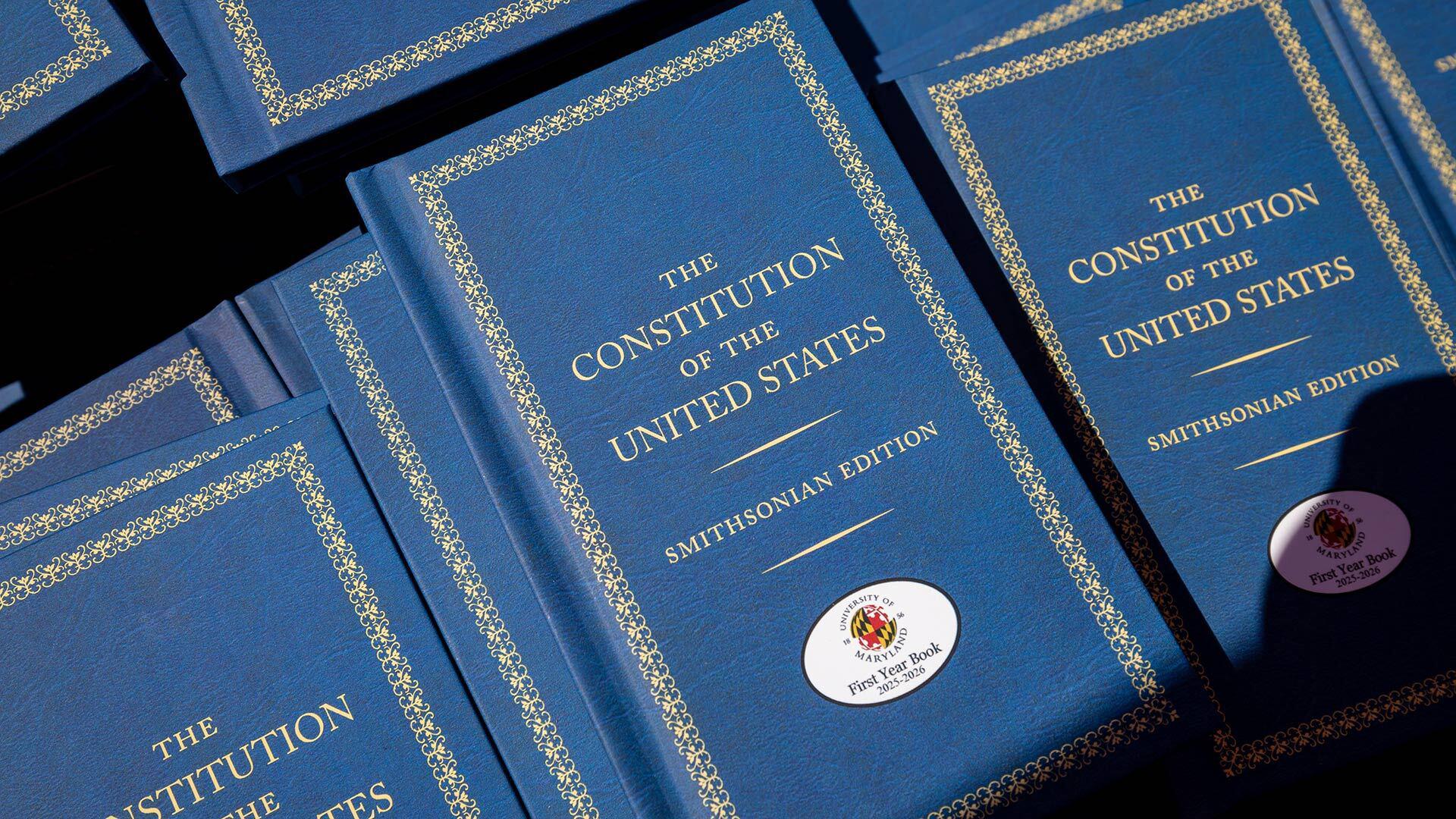 copies of the Constitution of the United States (Smithsonian Edition) with UMD First Year Book stickers on the cover