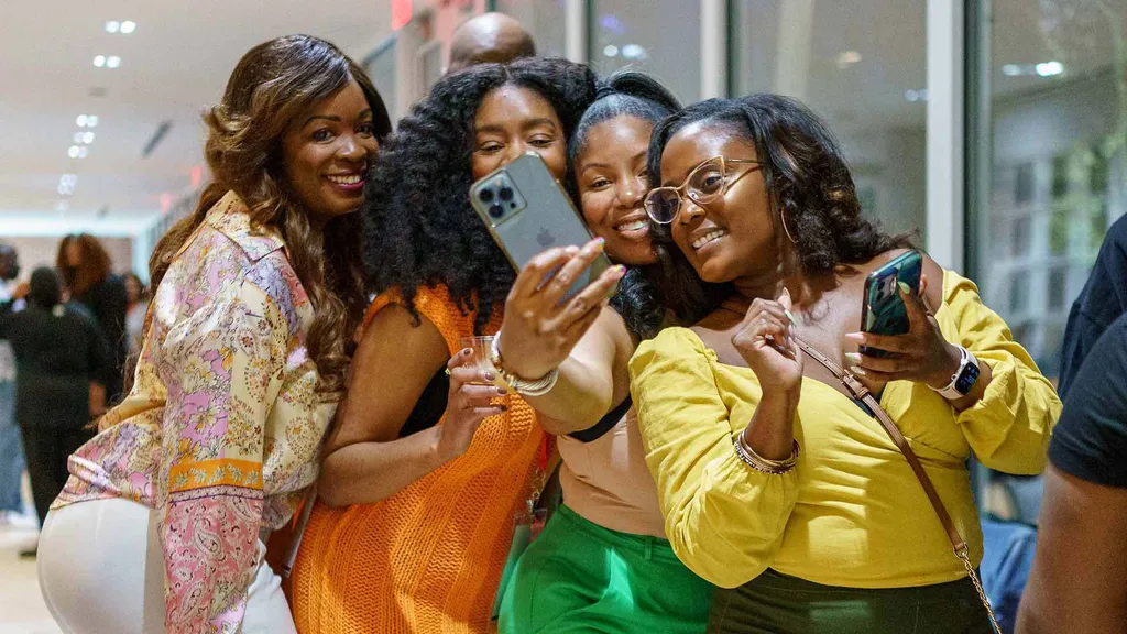 Tima Hawes '06, Andrea Jackson '08, Ja-Nee Jackson '06 and Shiron Lindsay '09 take a selfie.